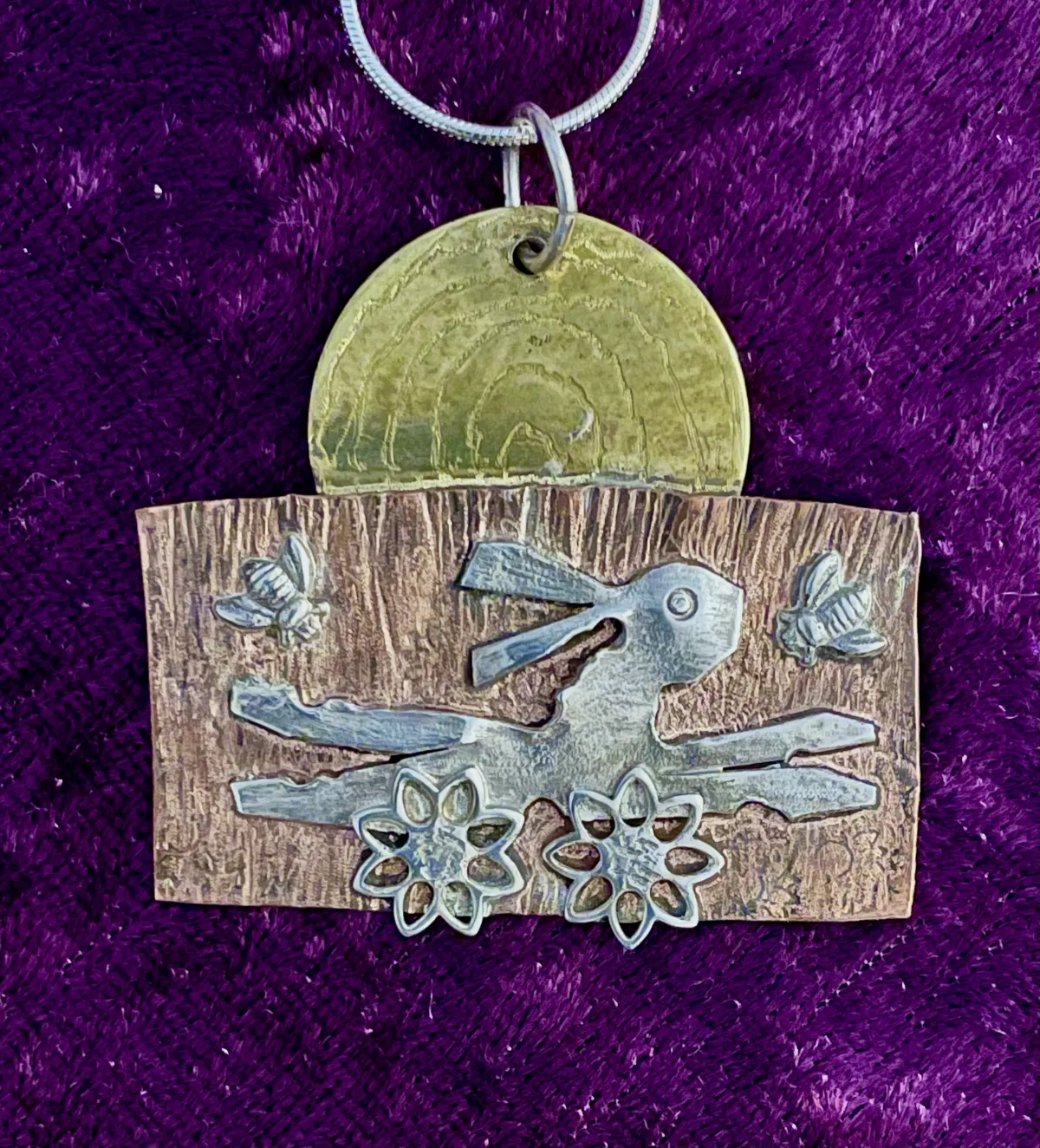 Silver hare on copper pendant