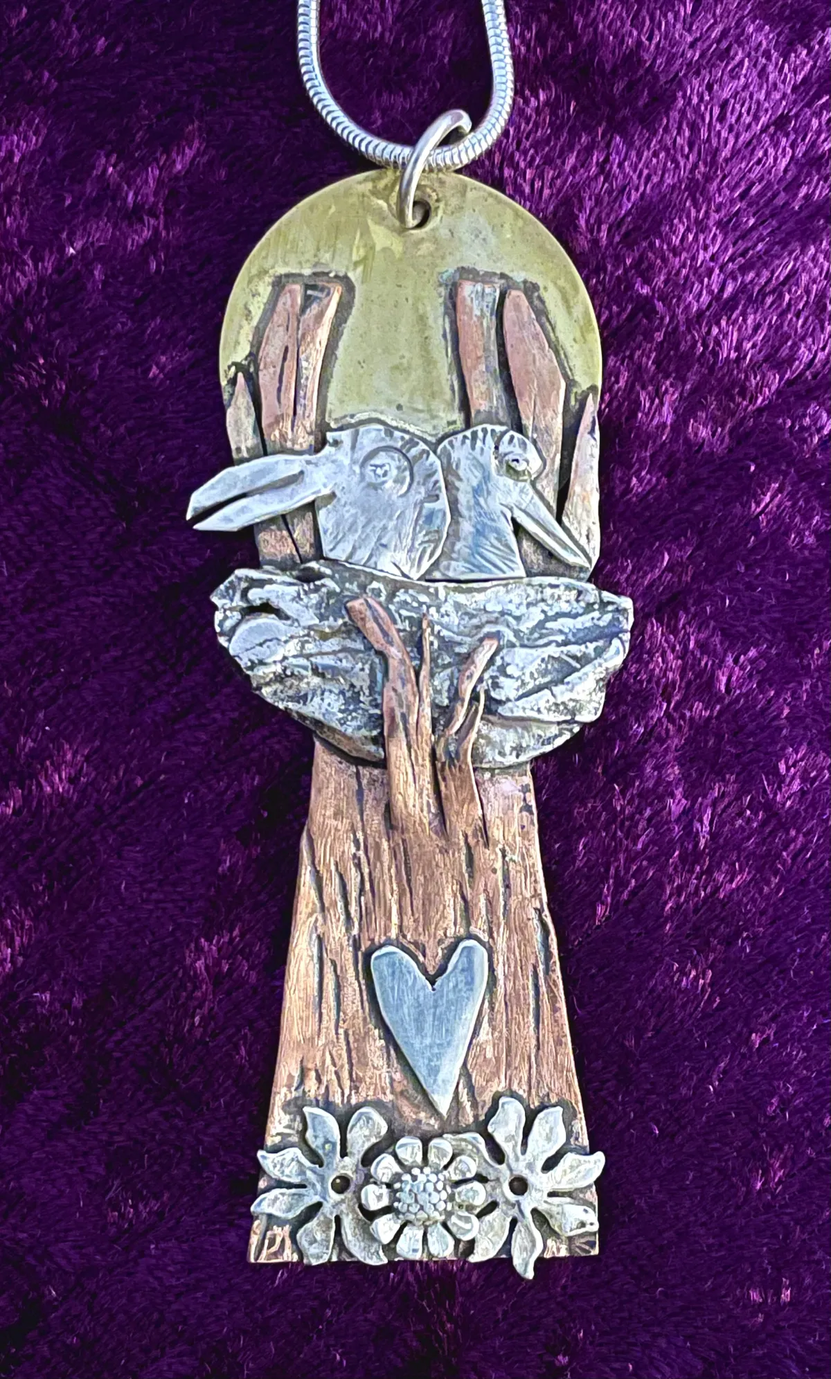 Silver birds in a nest