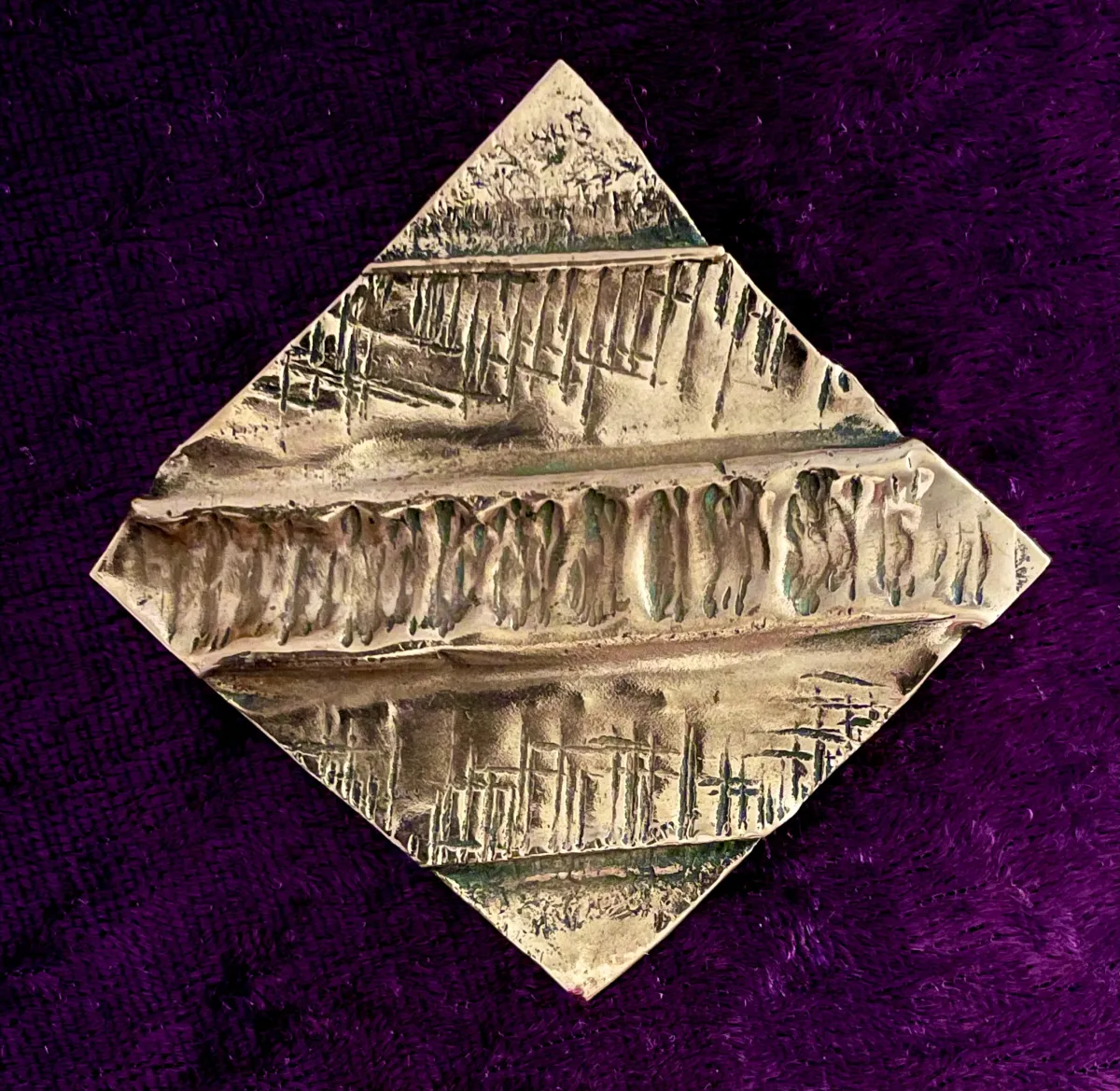 Hammered copper brooch