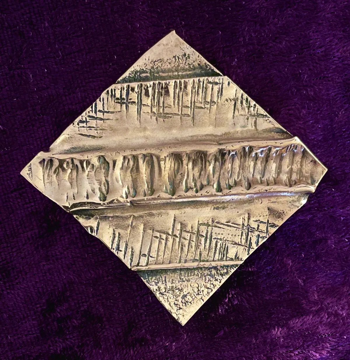 Hammered copper brooch