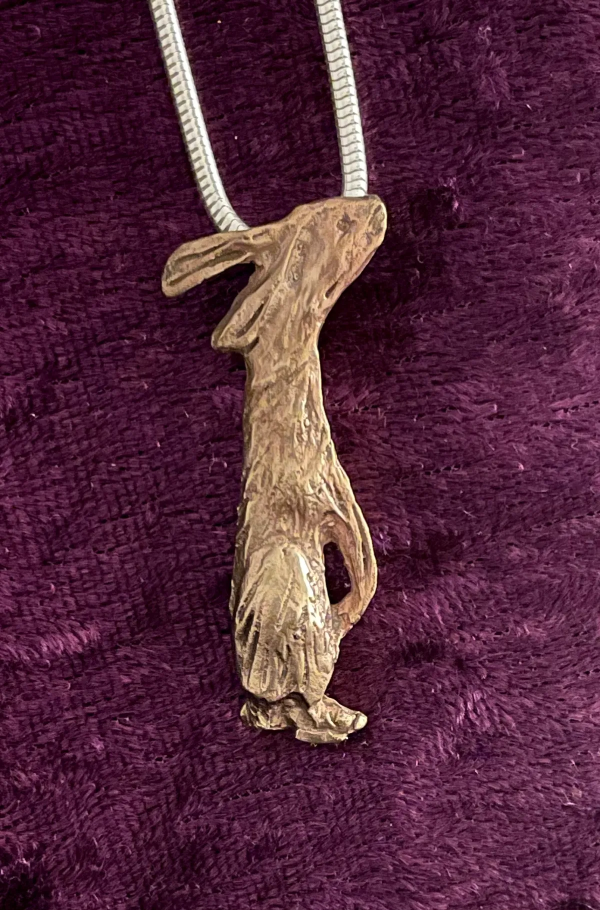 Textured bronze hare pendant