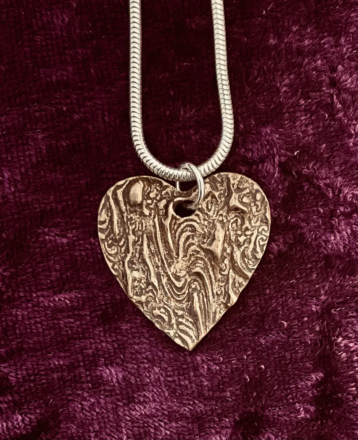 Textured bronze heart pendant
