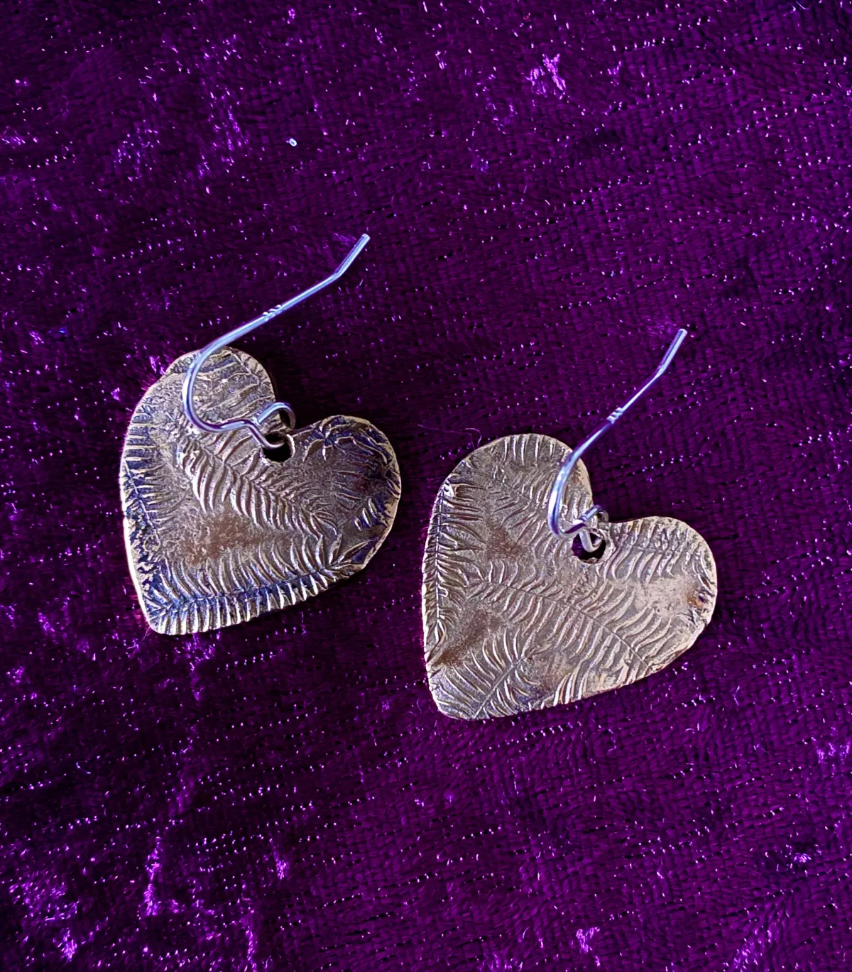 Textured bronze heart shaped earrings