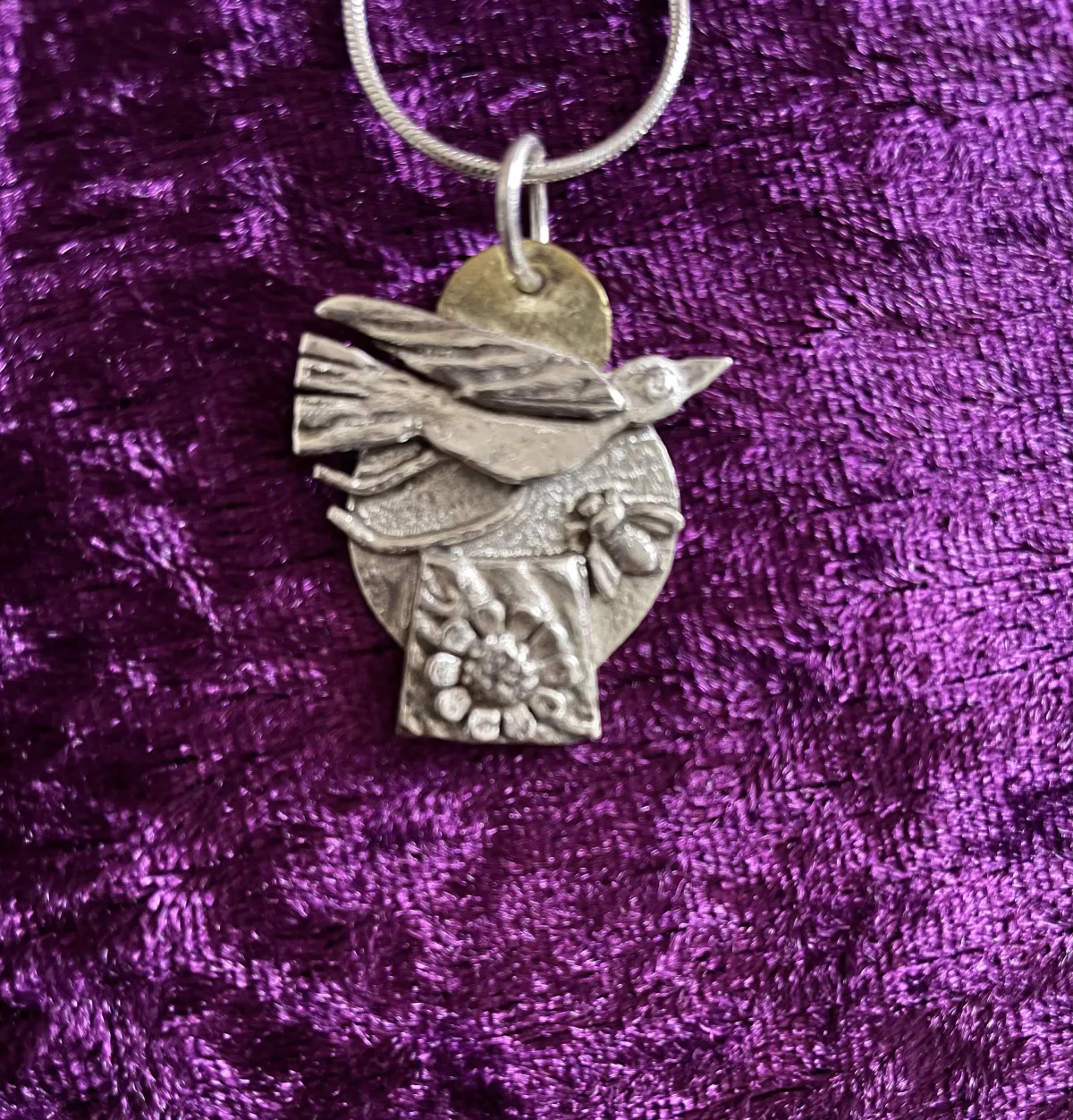 Silver bird and flowers pendant