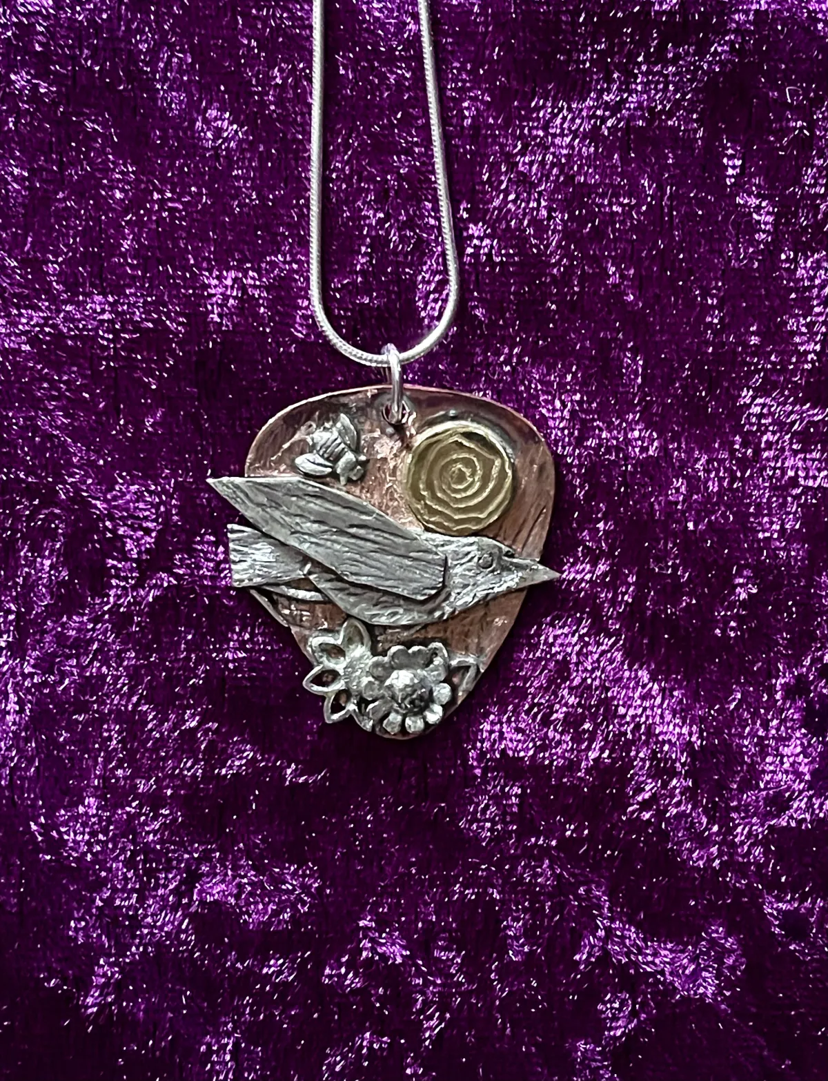 Bird in silver pendant