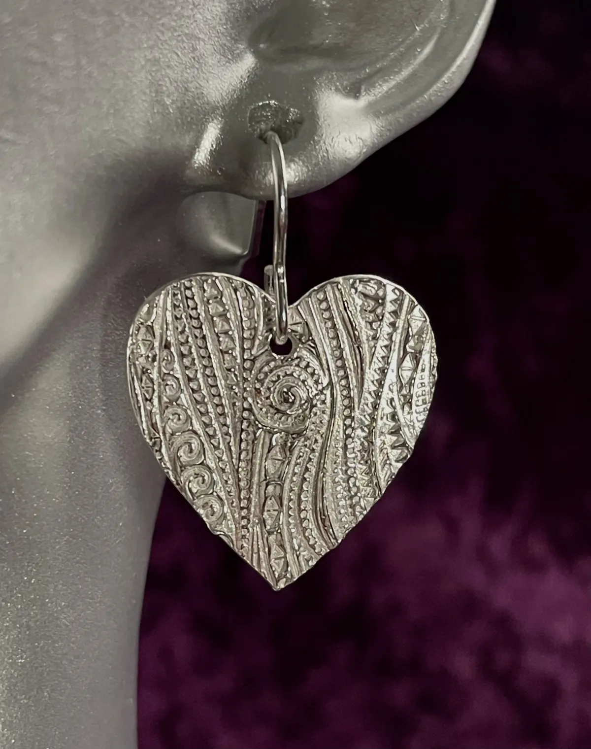 Silver heart shaped earrings
