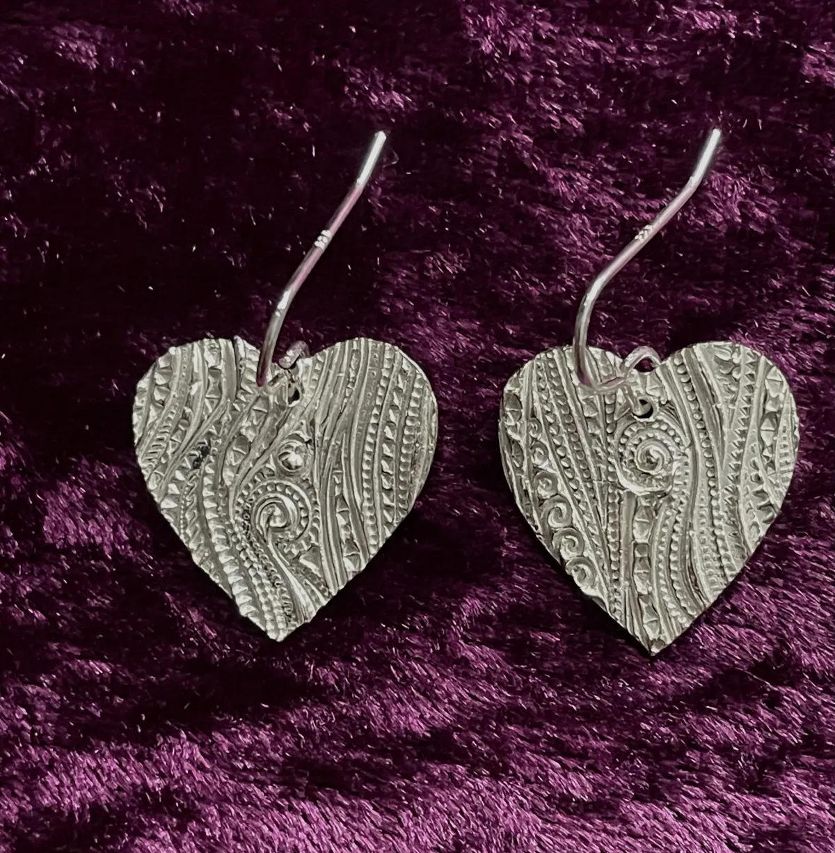 Silver heart shaped earrings
