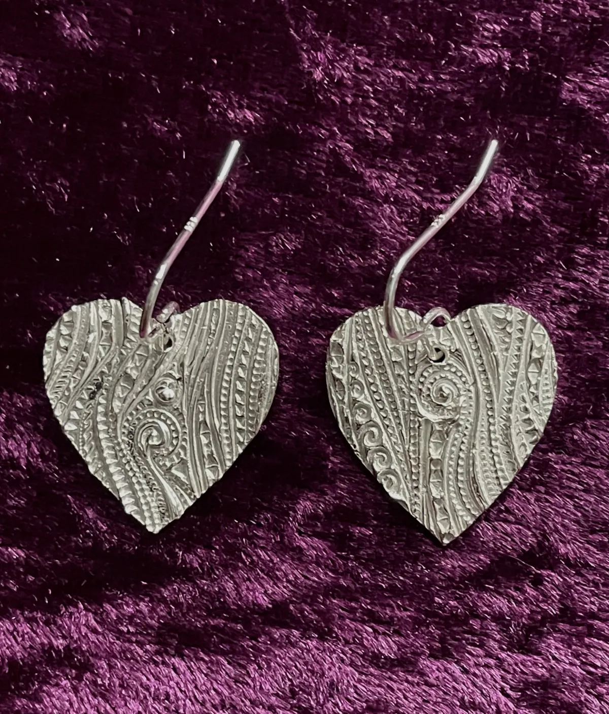 Silver heart shaped earrings