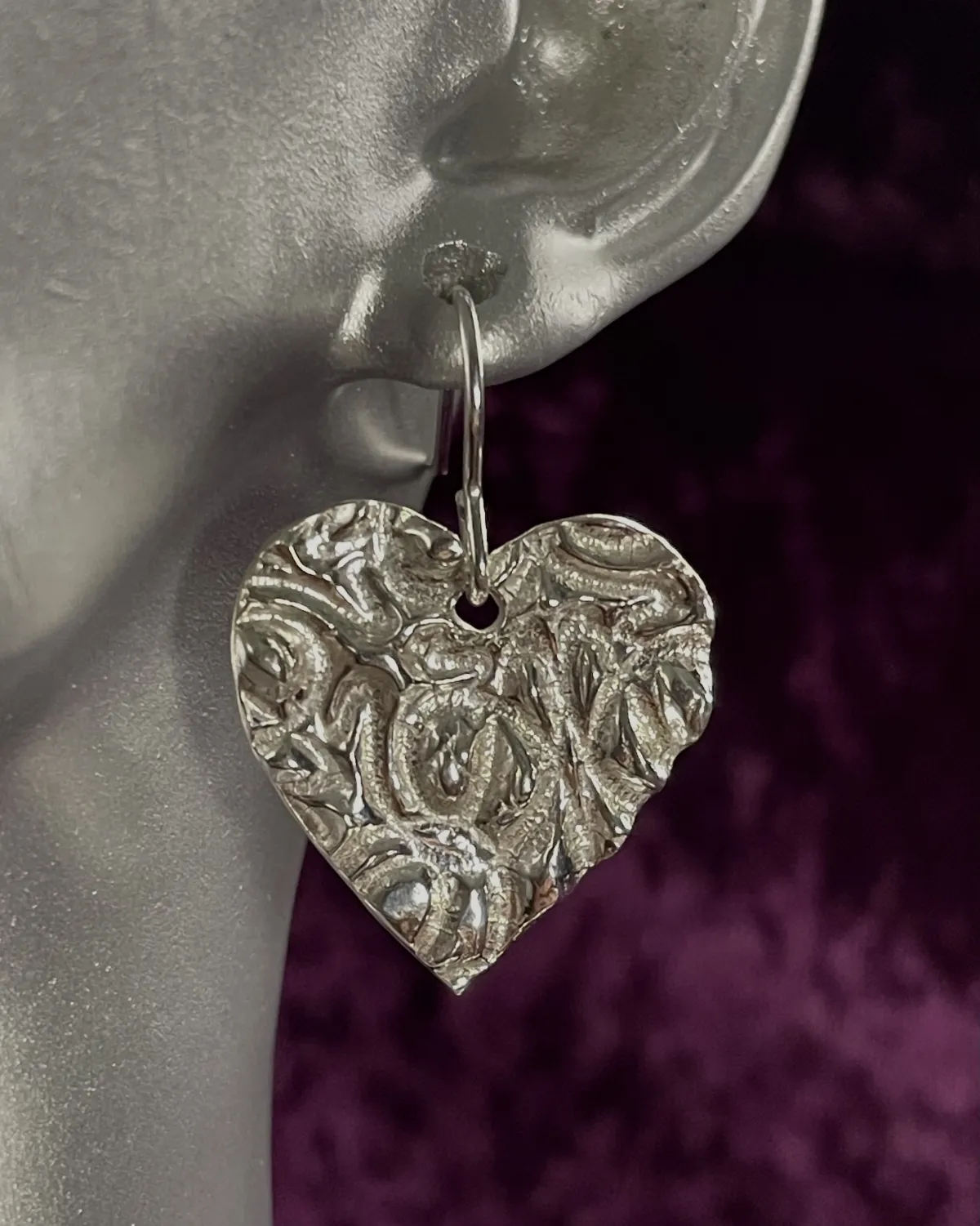 Textured silver heart shaped earrings