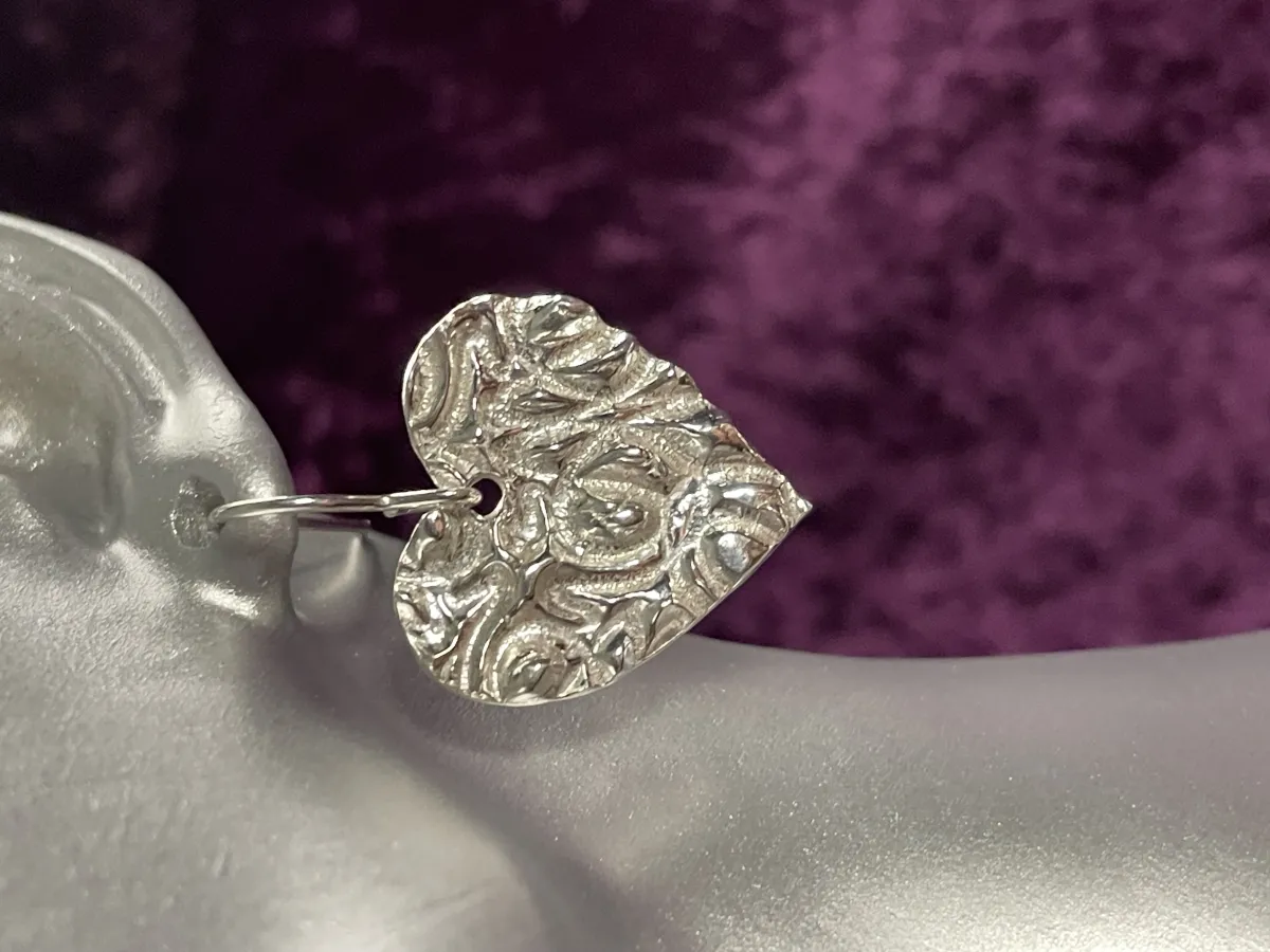 Textured silver heart shaped earrings