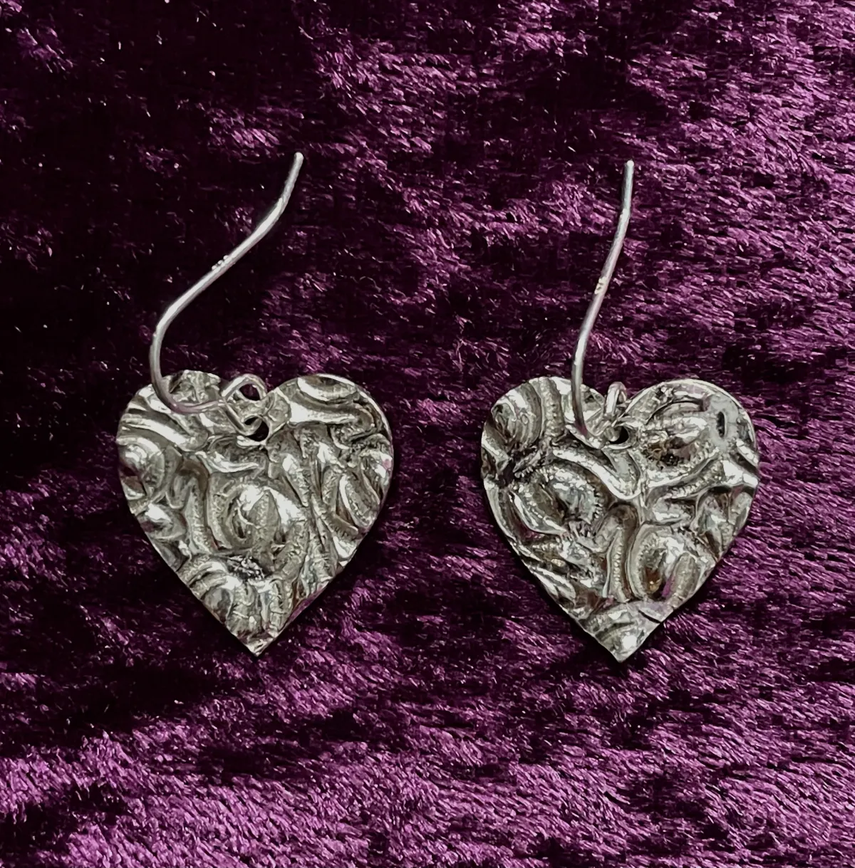 Textured silver heart shaped earrings