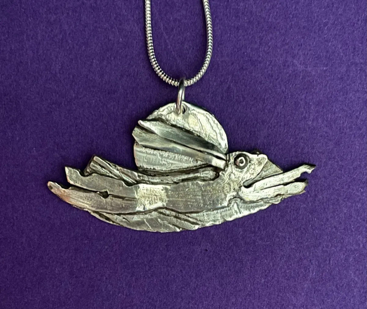 All silver running hare pendant