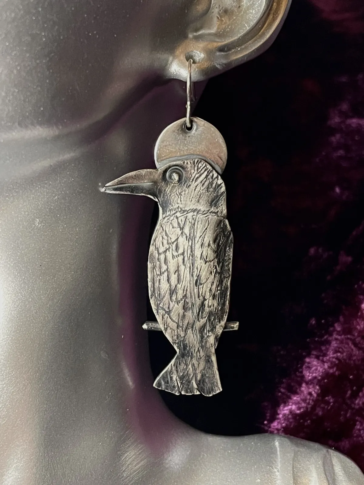 Silver Raven earrings.