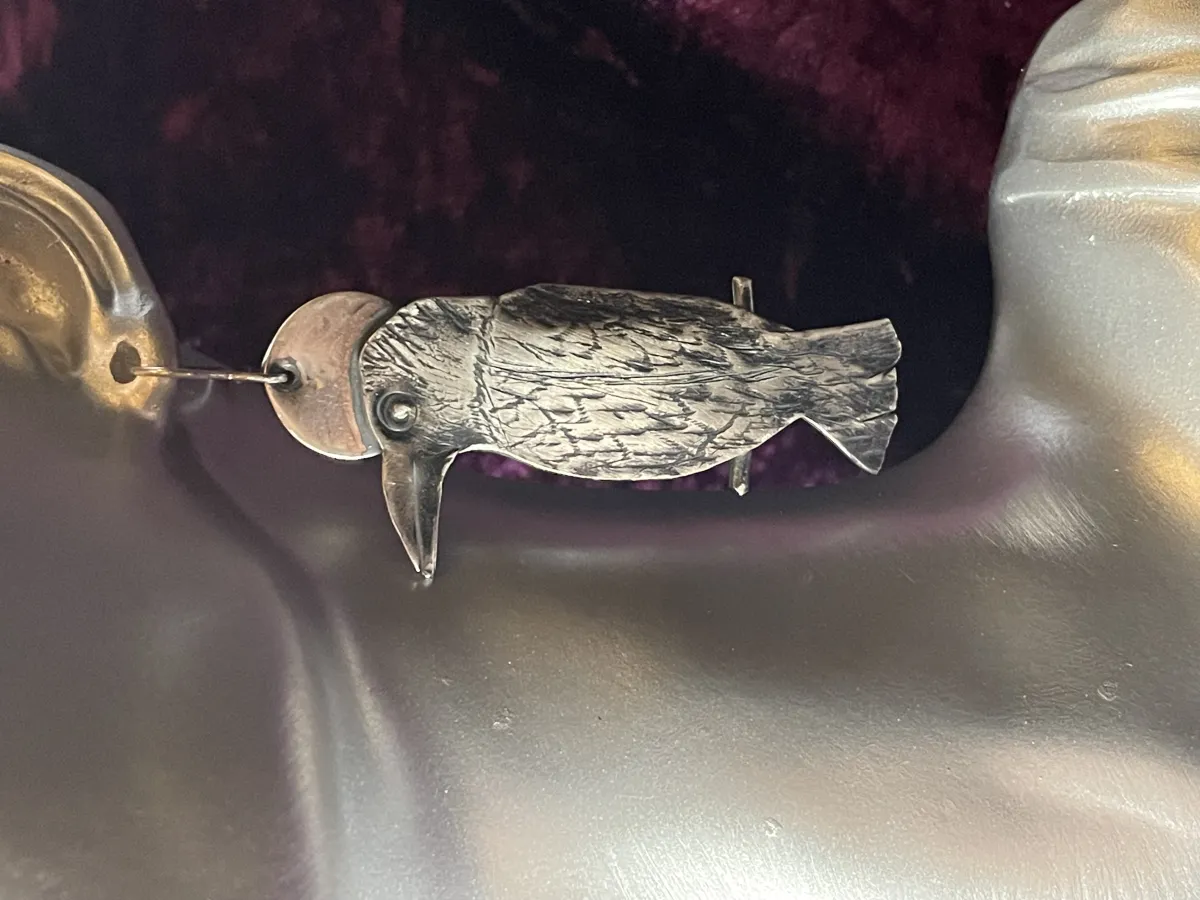 Silver Raven earrings.