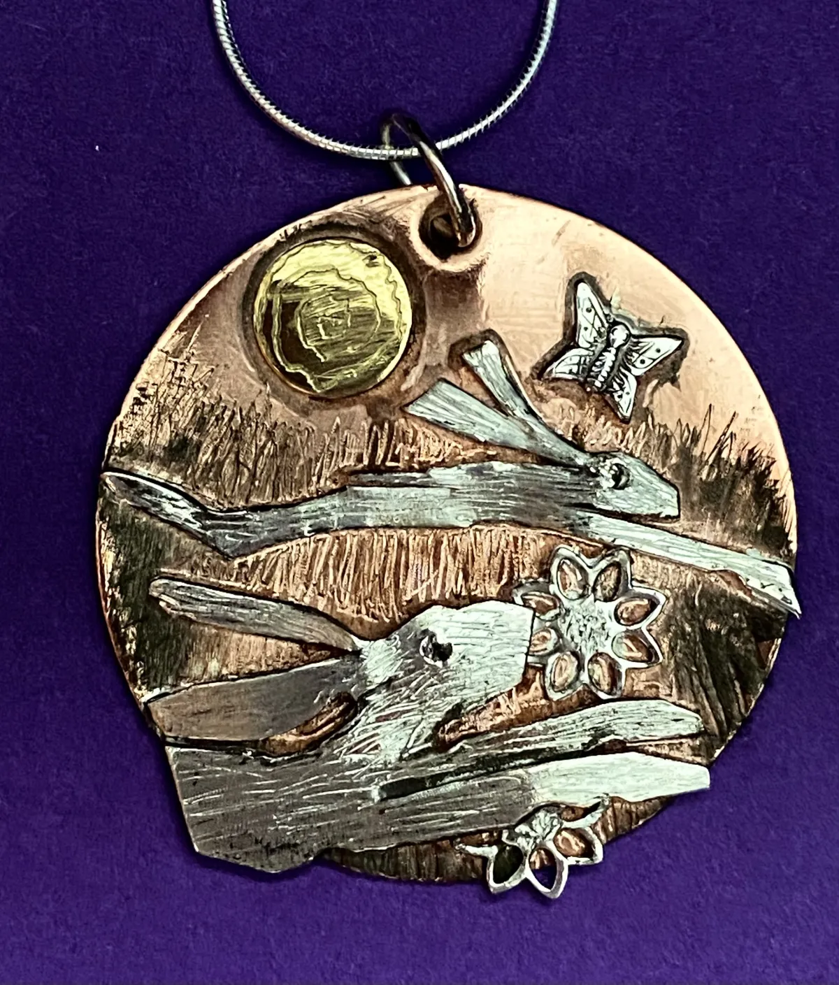 Running hares pendant