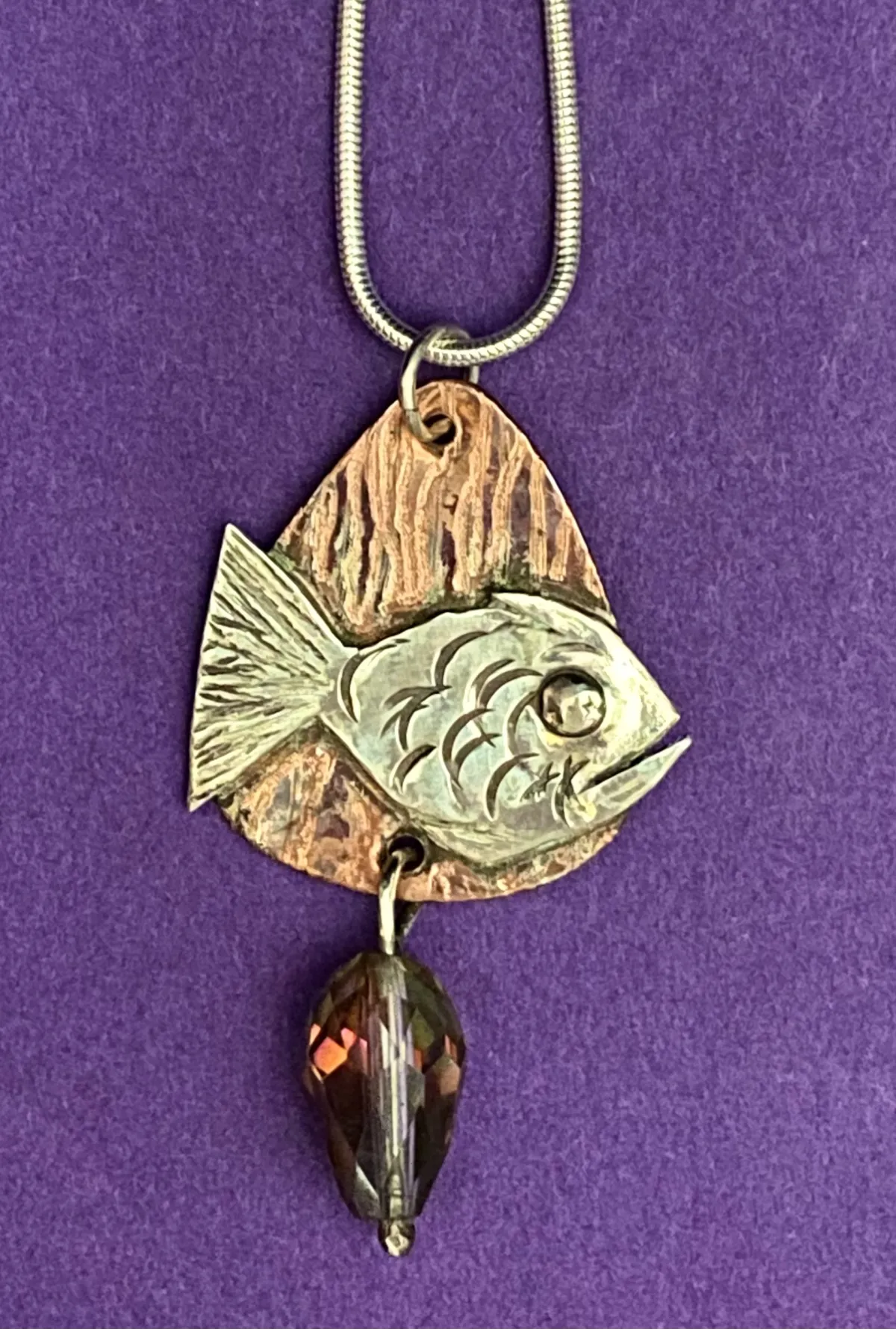 Silver fish on copper