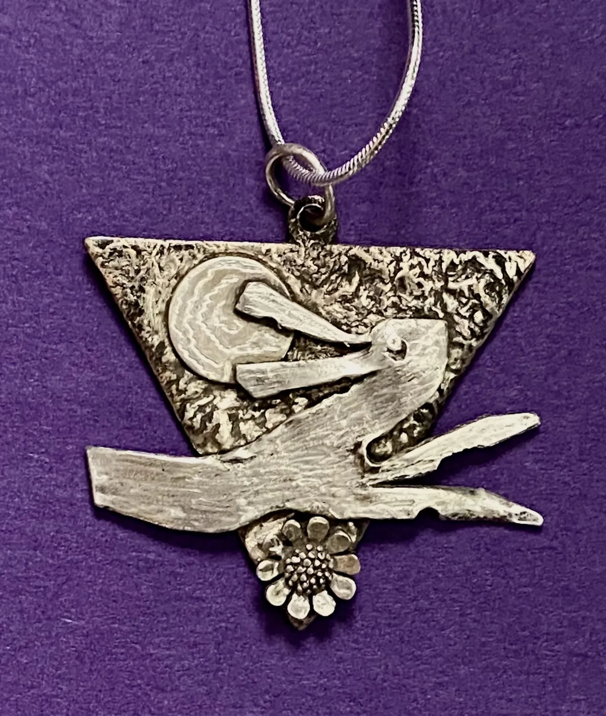 Silver hare on copper pendant