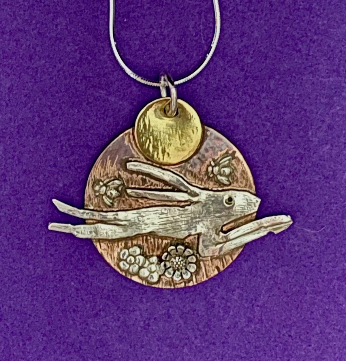Hare in flight pendant